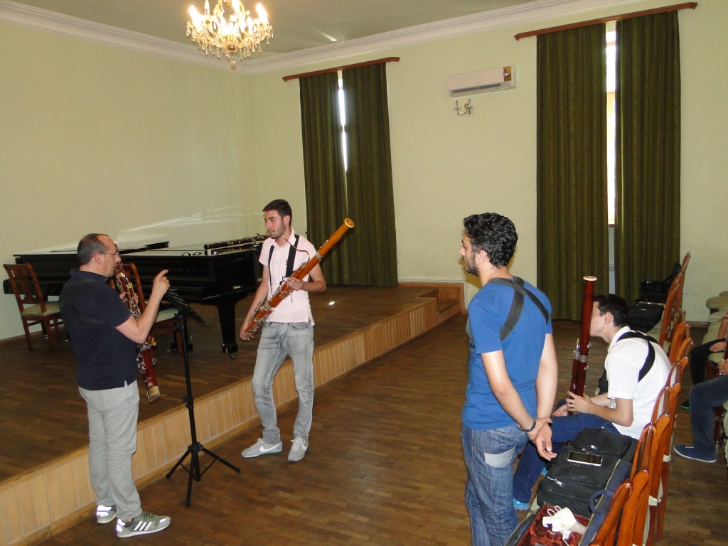 Solo_bassoon_player_Giuseppe_Ciabocchi_with_the_group_of_young_bassoon_players.JPG